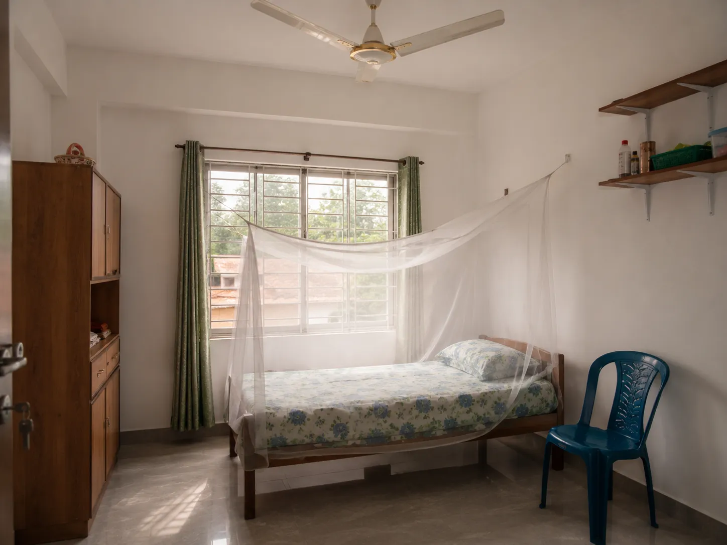 Example photo — a resident bedroom at a shared housing facility